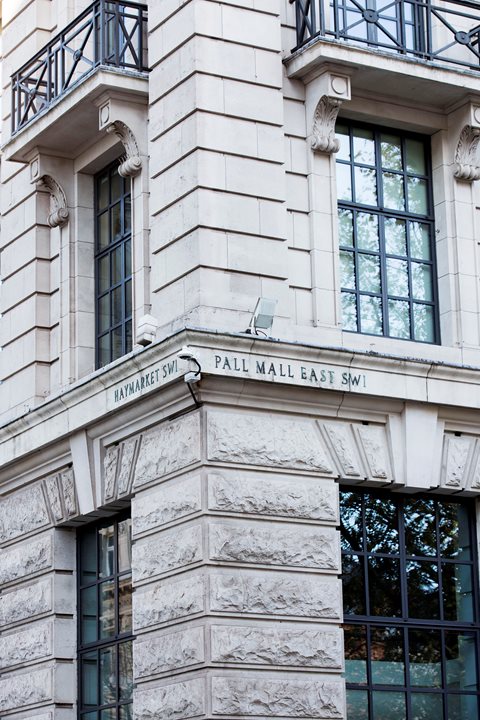 stone street sign for the corner of haymarket and pall mall